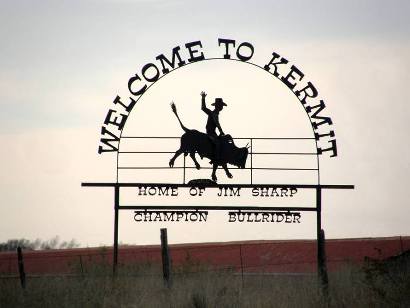 Picture of a welcome sign that says, Welcome to Kermit, Texas. Home of Jim Sharp (Champion Bullrider).